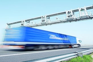 Image shows a truck on a toll road