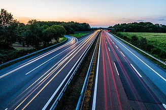 The photo shows free flow traffic on a highway
