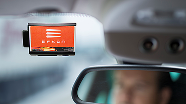 Image shows an EFKON in-vehicle unit (OBU)