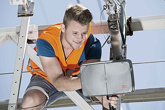 The image shows a Microwave Transceiver mounted on a gantry